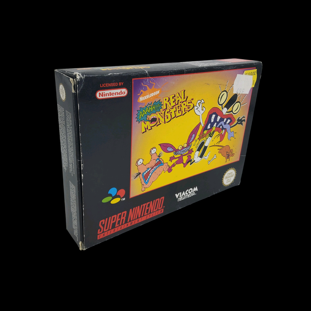 Nintendo – Super Nes – Jeu : Real Monsters. Avec cale en carton, boîte, notice.