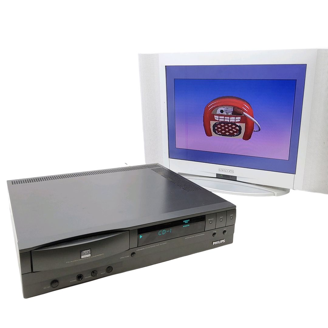 PHILIPS – Console de salon Philips CDI-205 – 4 jeux associés : Pinball, The classics you love, cartoon Jukebox, Battleship. Avec cordon d&rsquo;alimentation, câble TV, télécommande.